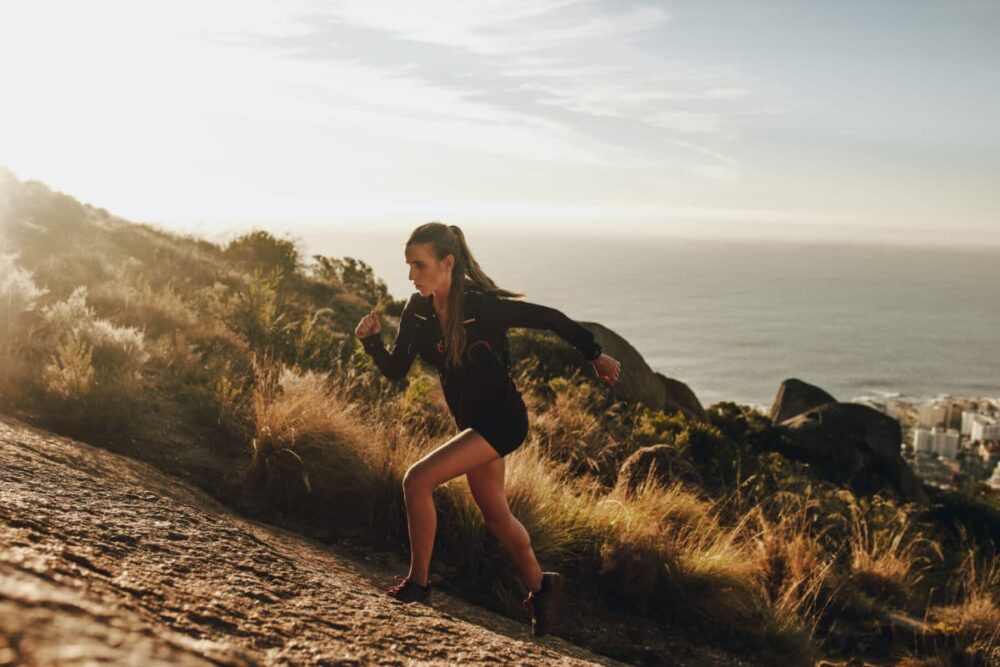 Runner's Guide to Prevent Pain runner pushing past discomfort uphill