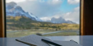 diary open with view of the mountains on the background