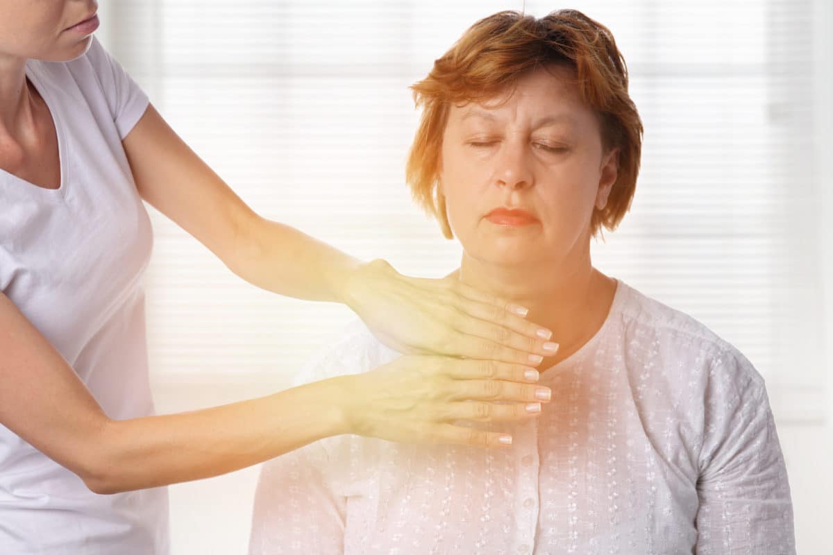 Reiki for Pain Management woman receiving Reiki treatment