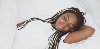 Black woman reducing chronic pain and sleep debt
